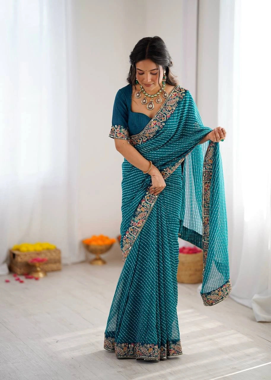 Teal blue leheriya saree with embroidered border – model pose
